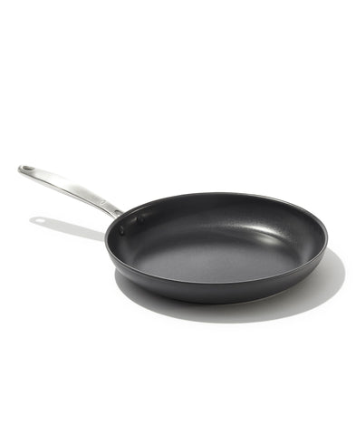 OXO 10-inch frying pan front view showing black hard-anodized finish and handle for durable cooking