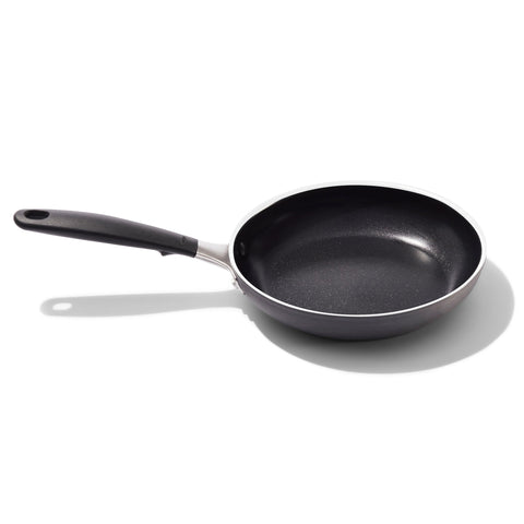 OXO 8-inch frying pan front view showing black ceramic finish and handle, easy cooking