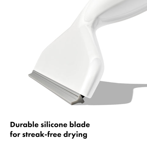 OXO squeegee in bathroom lifestyle setting demonstrating fast water removal benefit