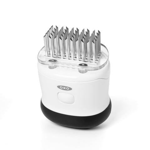 OXO close-up of 50 stainless blades revealing sharp pattern for faster marinating