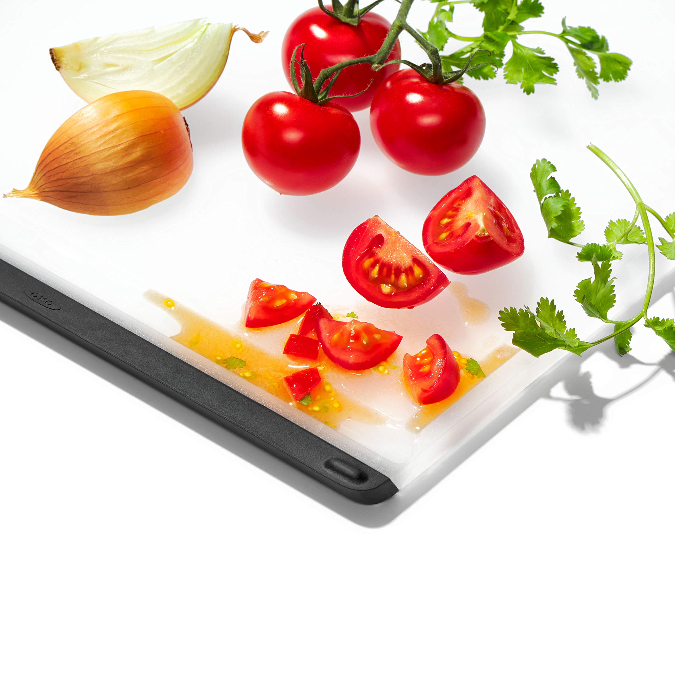 OXO board in use slicing meat demonstrating separate side use