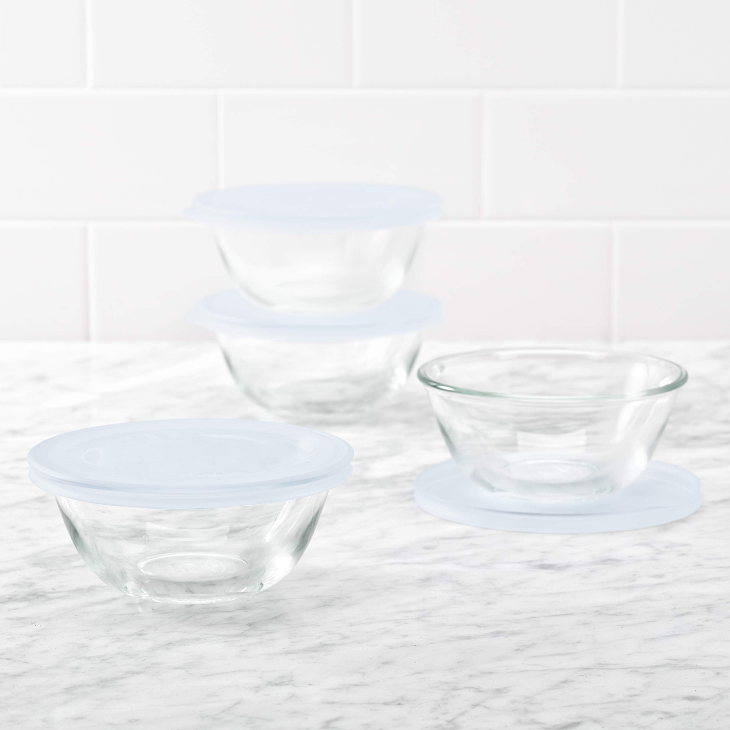 OXO bowls stacked in refrigerator with lids, compact stackable organization benefit