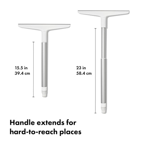 OXO squeegee extended handle in use reaching shower door for ergonomic benefit