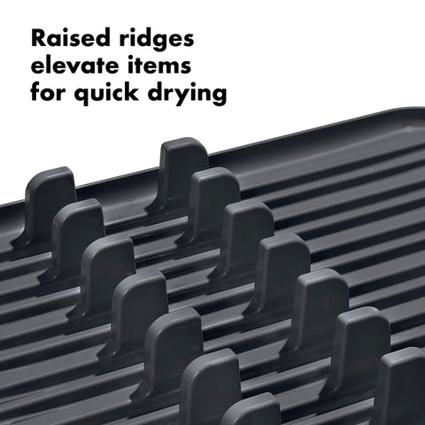 OXO Good Grips adjustable drain tray angled to sink preventing countertop puddles