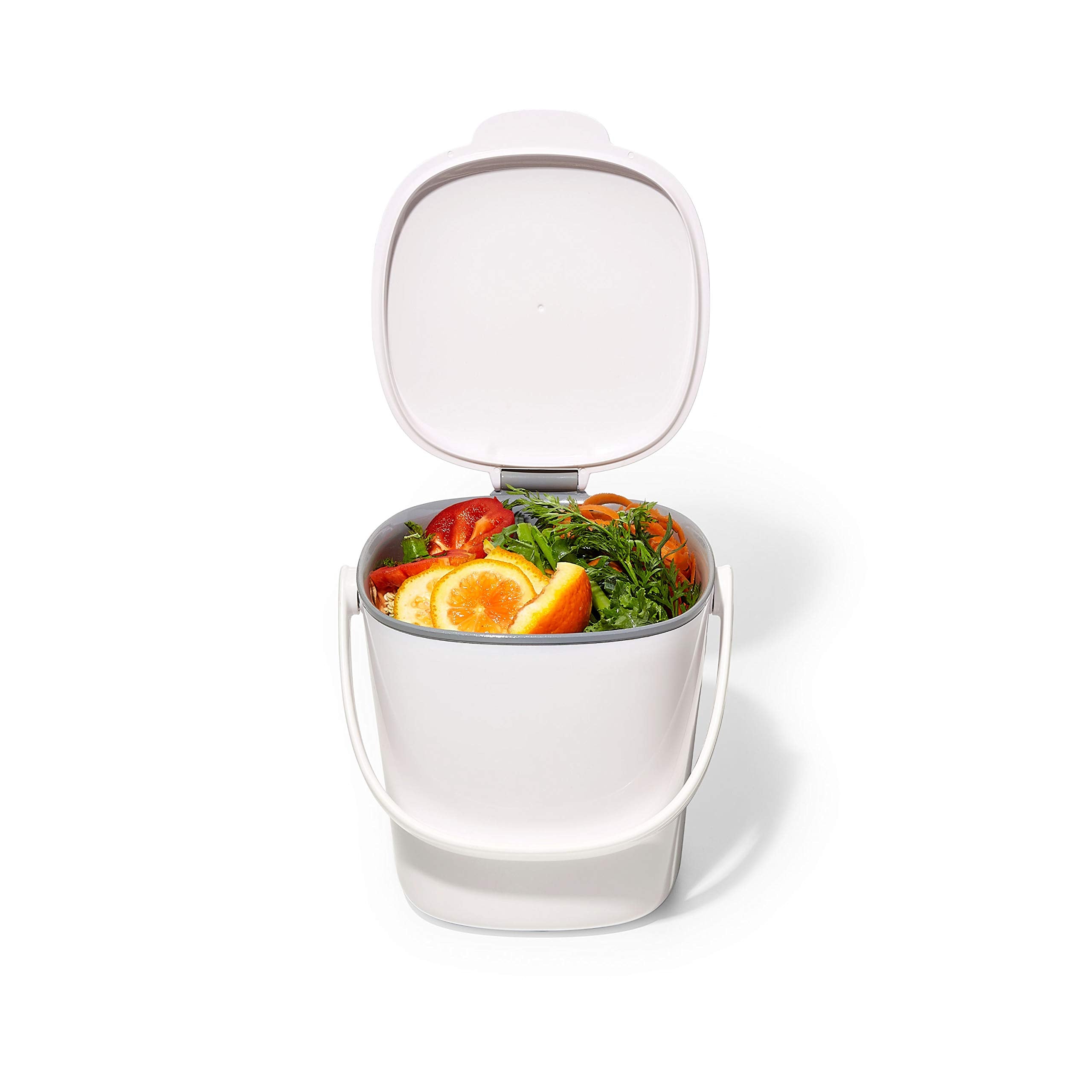 OXO Good Grips being filled with food scraps to demonstrate everyday use