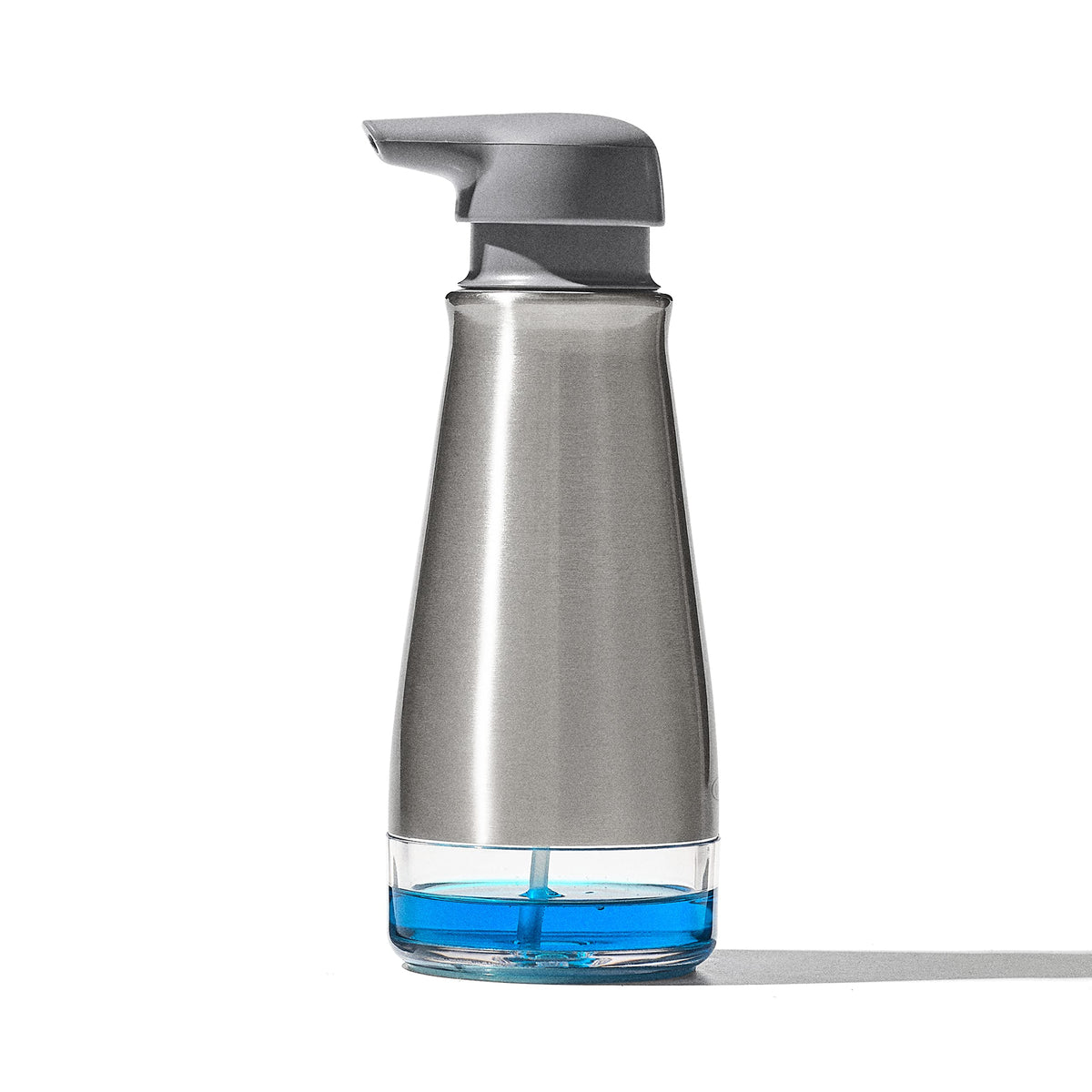 OXO Good Grips dispenser front view showing sleek stainless steel and stable base benefit