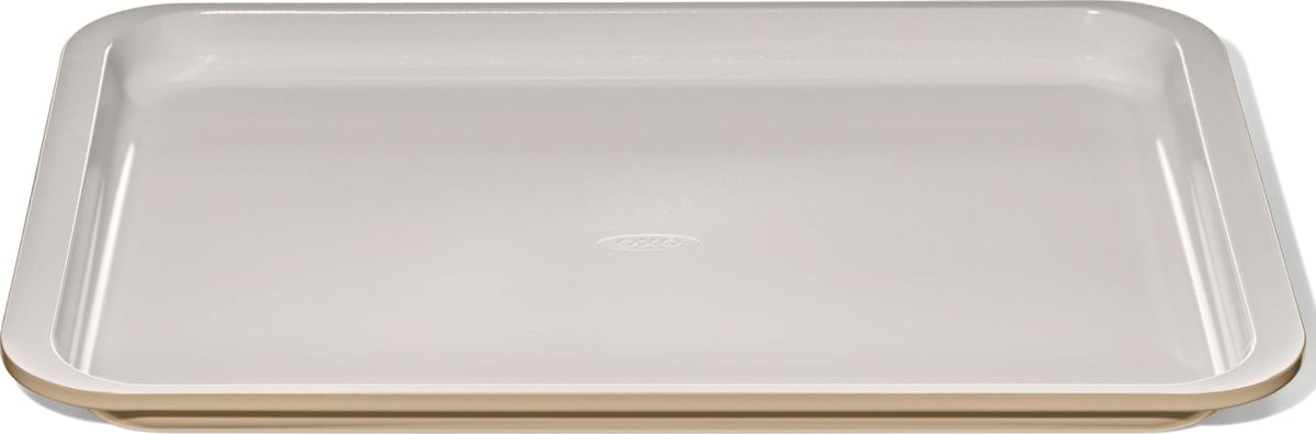 OXO Good Grips half sheet pan front view showing biscuit finish and sturdy build for even baking