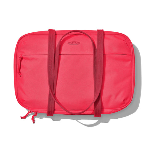 OXO Good Grips carrier on potluck table with dishes, simplifies serving and transport