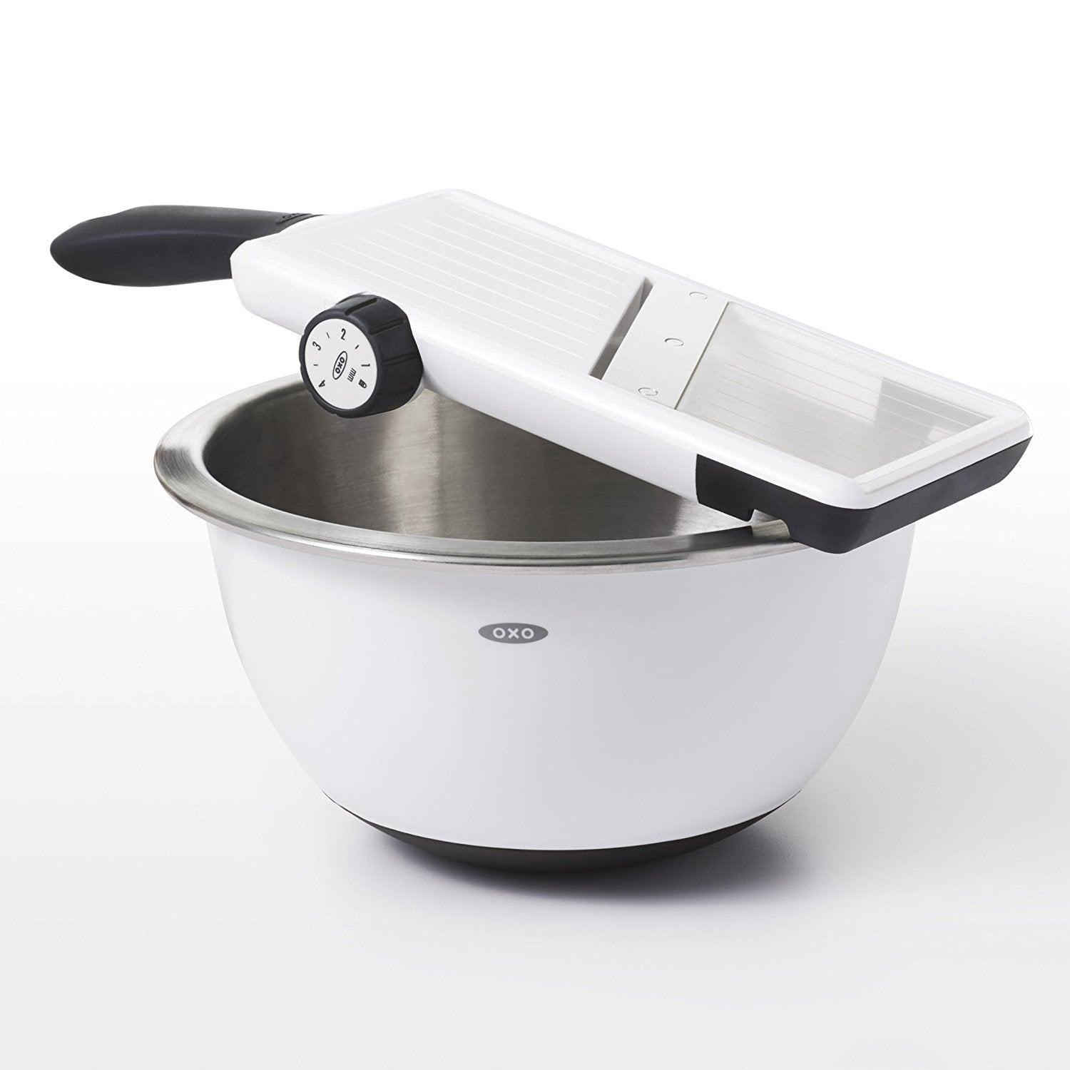 OXO mandoline food holder close-up protecting fingers and securing produce