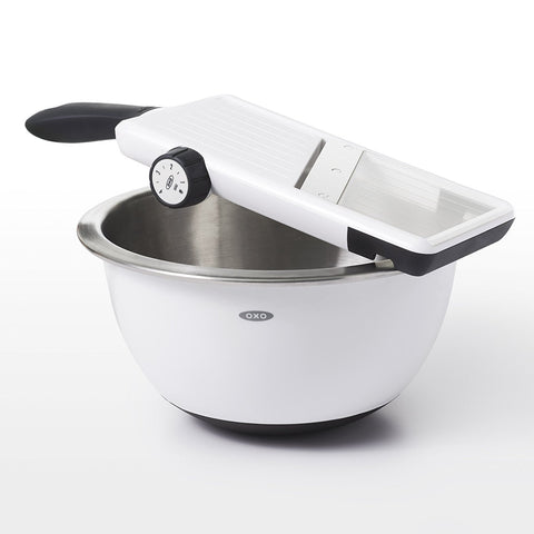 OXO mandoline food holder close-up protecting fingers and securing produce