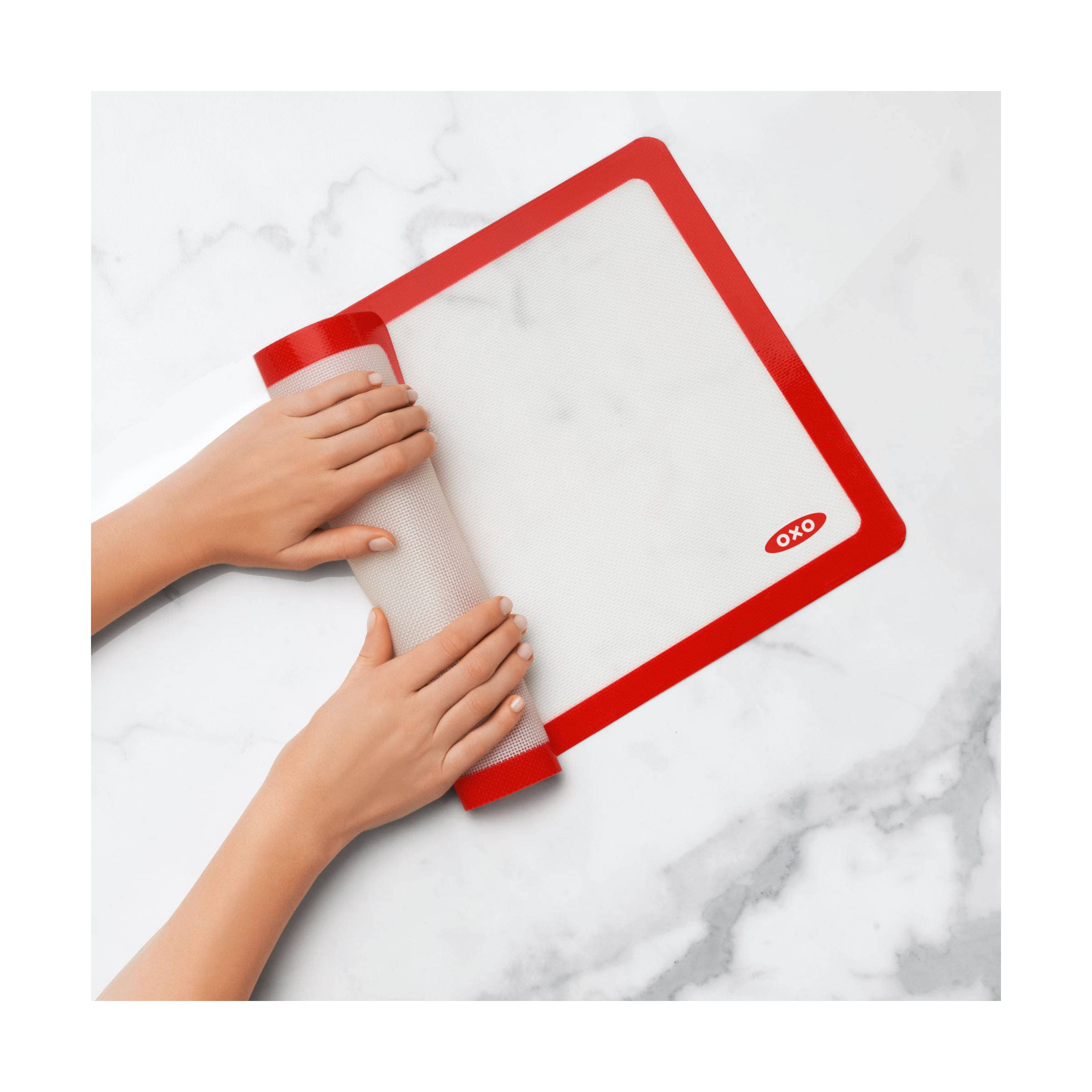 OXO Good Grips mat beside a ruler and half‑sheet pan to show exact sizing