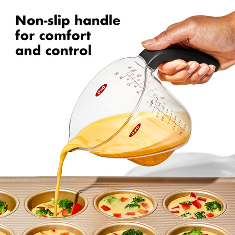 OXO cups measuring and pouring vinaigrette to speed prep and improve accuracy