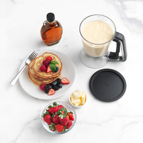 Transparent body with batter inside showing OXO dispenser capacity and contents