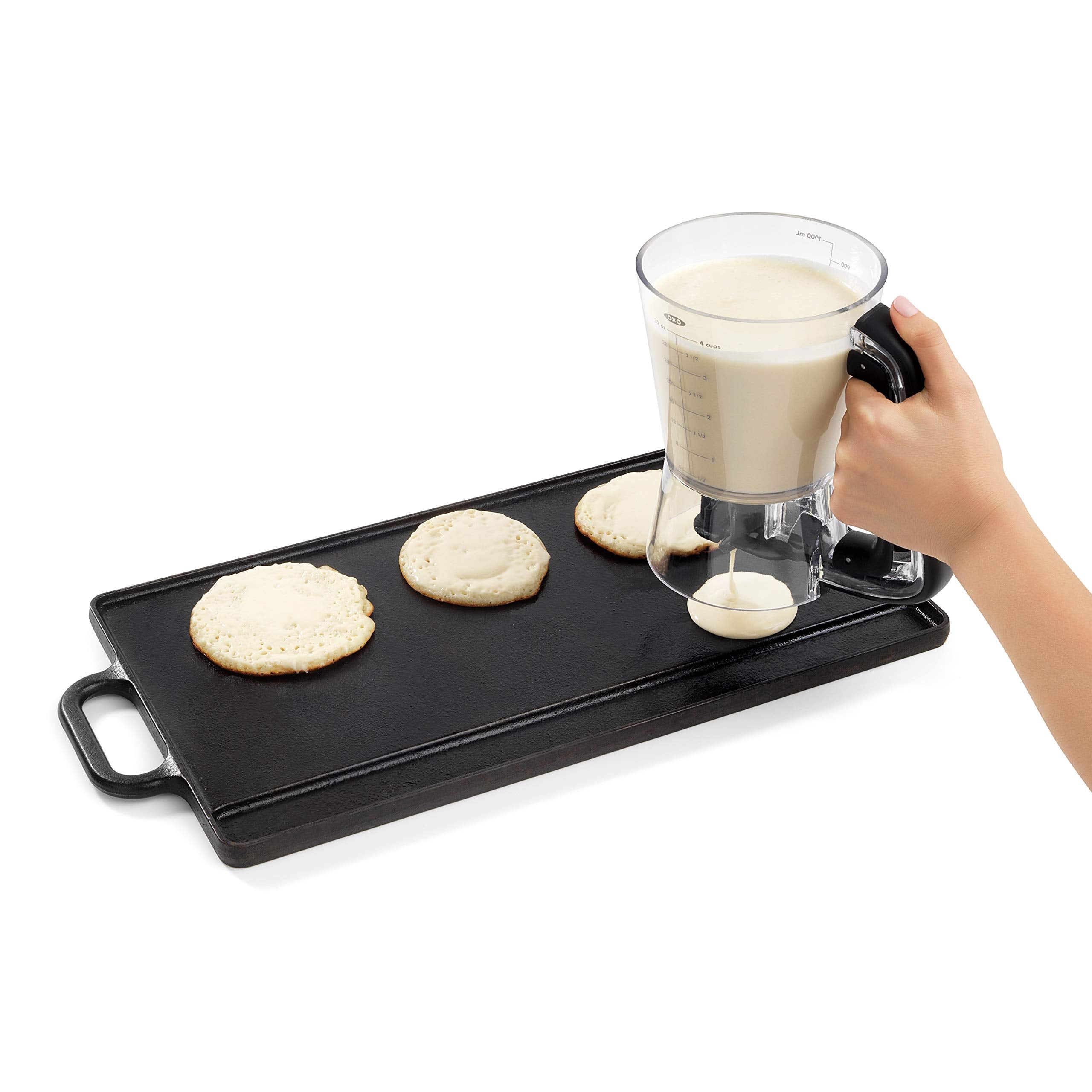 Soft-grip handle detail on OXO dispenser for comfortable squeeze control