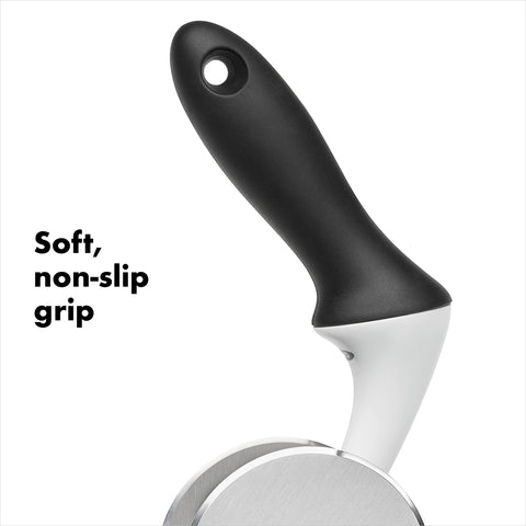 OXO Good Grips chopper being rotated in bowl to quickly chop salad