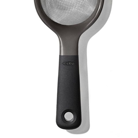 OXO Good Grips held in hand for size comparison and ergonomic benefit