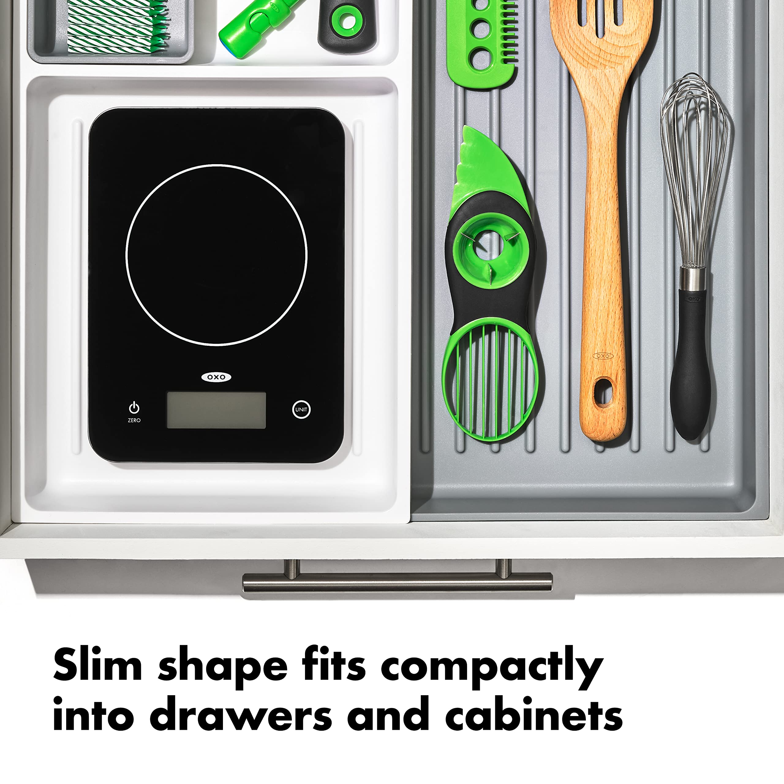 OXO Good Grips beside a hand for size comparison showing small footprint for tight counters
