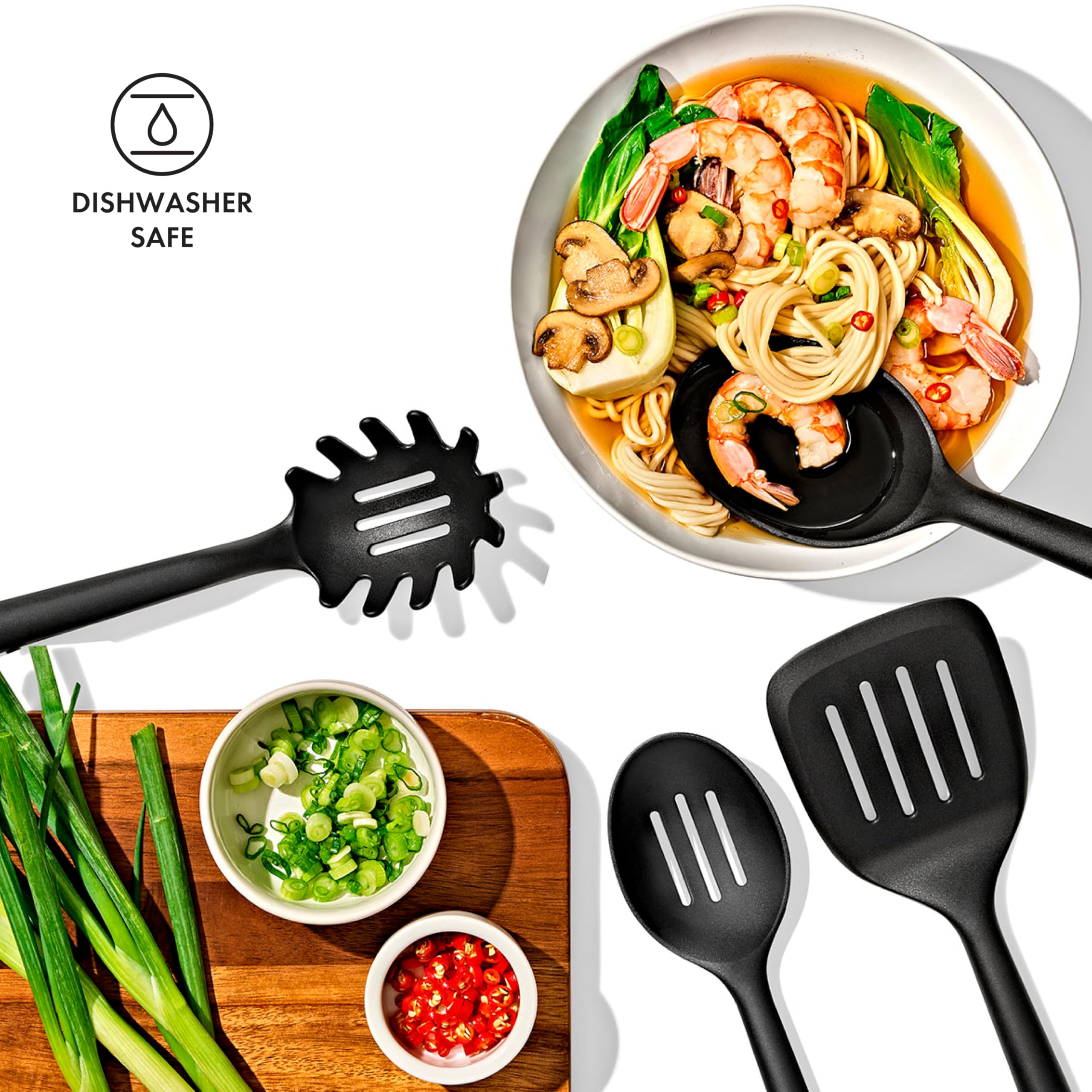 OXO utensil held in hand for scale showing long necks and ergonomic comfort benefit