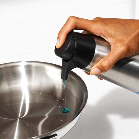 OXO dispenser in kitchen sink giving mess-free soap dispensing benefit