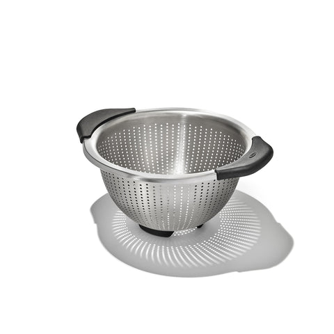 OXO Good Grips strainer front view showing sleek stainless steel and stable design benefit