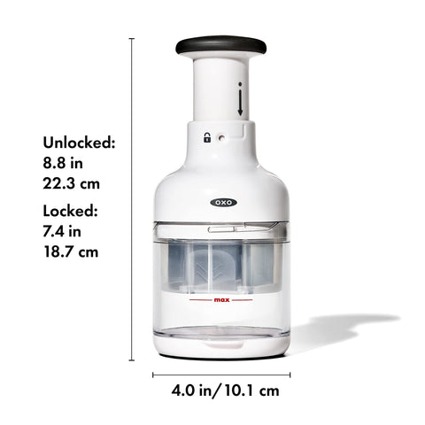 OXO Good Grips chopper beside hand and knife to show compact space-saving size