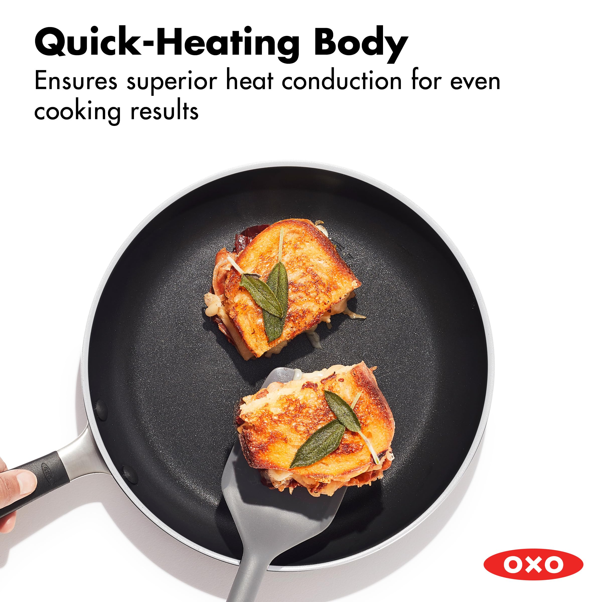 OXO silicone-wrapped handle close-up showing ergonomic grip for safer maneuvering benefit