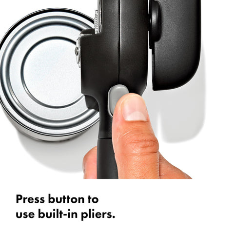 OXO lid pliers in action gripping lid for contact-free removal benefit