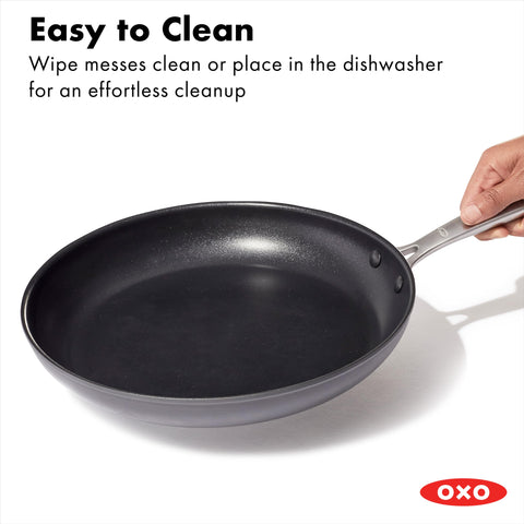 OXO lifestyle kitchen shot with pan on stovetop emphasizing everyday cooking convenience