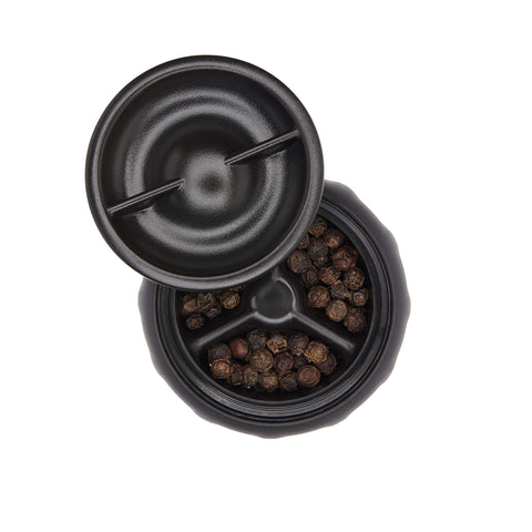 OXO grinders on dining table with food, shows elegant serving and convenience benefit