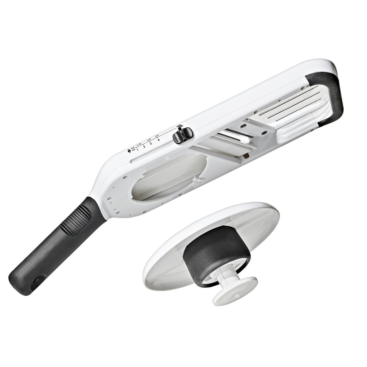 OXO adjustable food holder closeup protecting fingers and ensuring even pressure