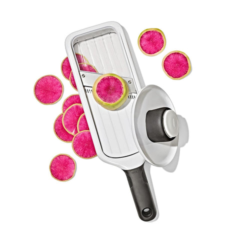 OXO mandoline slicing potatoes on countertop illustrating everyday kitchen use