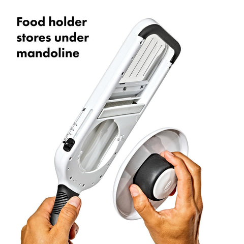 OXO mandoline with food holder stored underneath saving space and keeping parts together