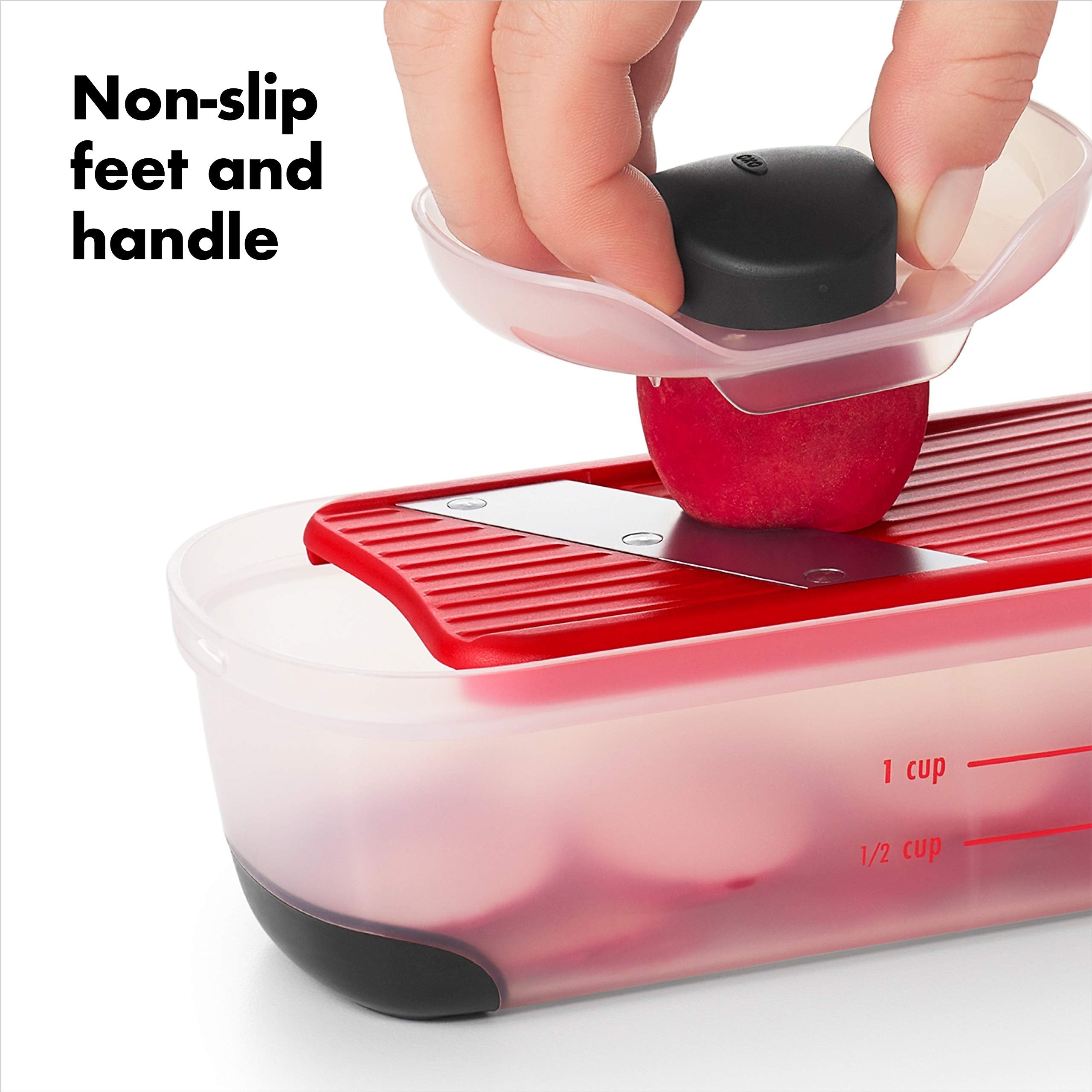 OXO Good Grips mini food holder in use protecting fingers while slicing