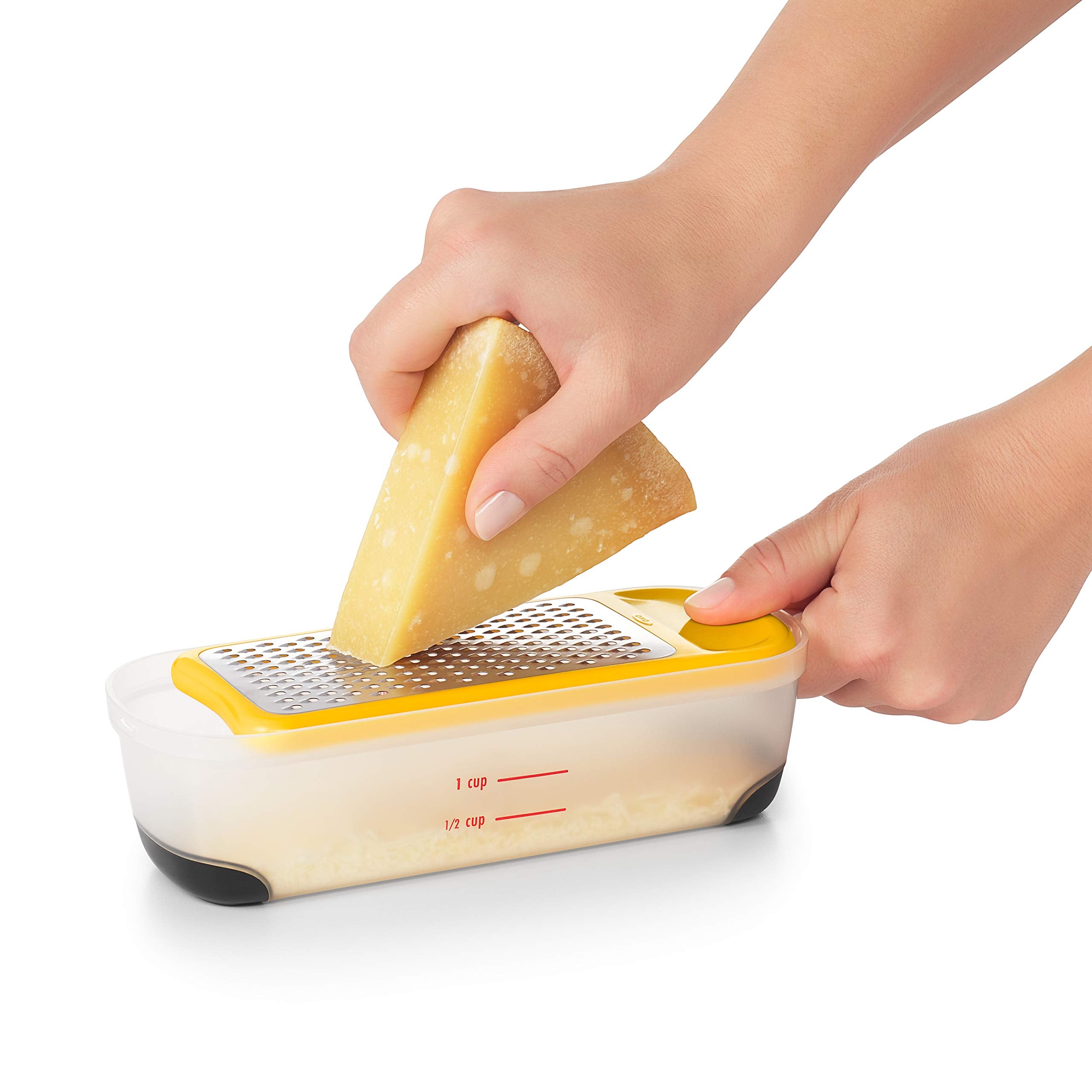 OXO Good Grips mini next to a hand and phone for size comparison convenience