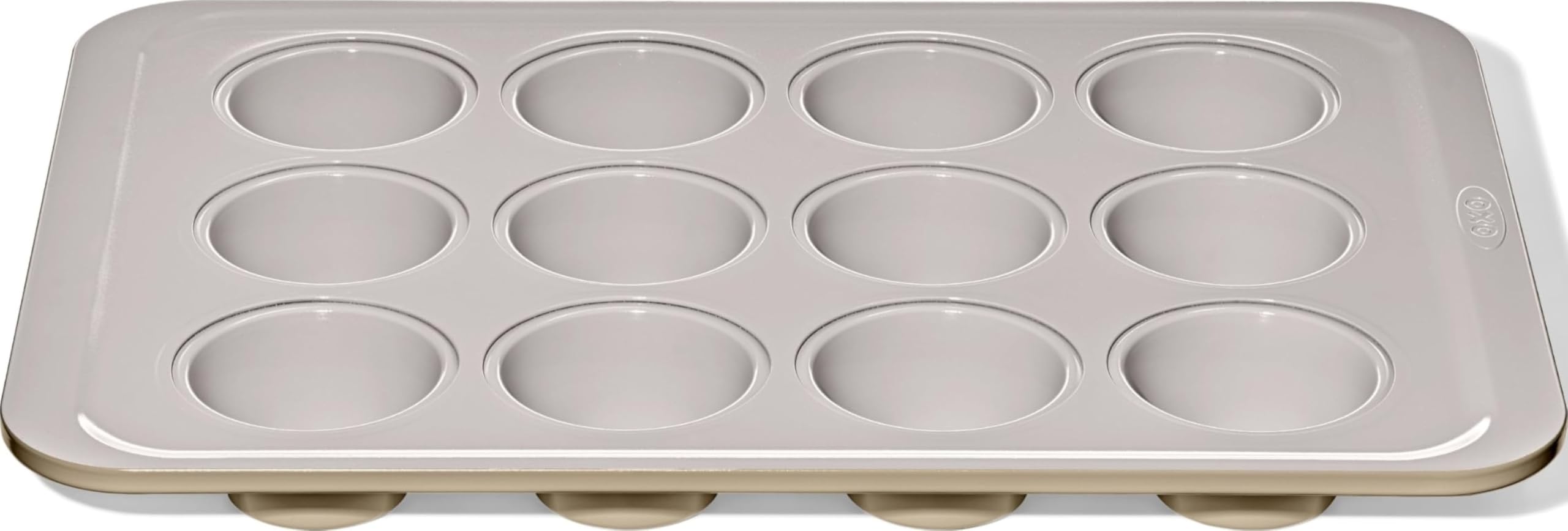 OXO Good Grips muffin pan front view showing full 12-cup layout and sturdy build benefit