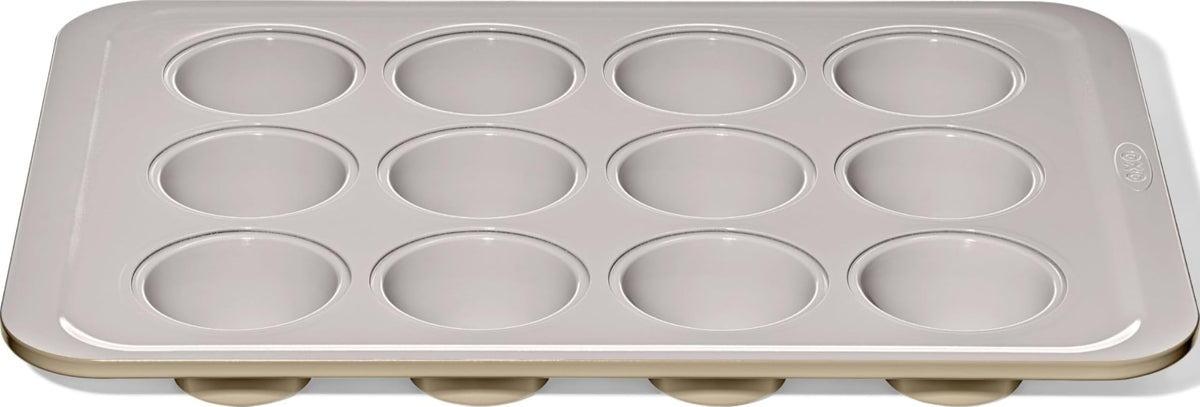OXO Good Grips muffin pan front view showing full 12-cup layout and sturdy build benefit