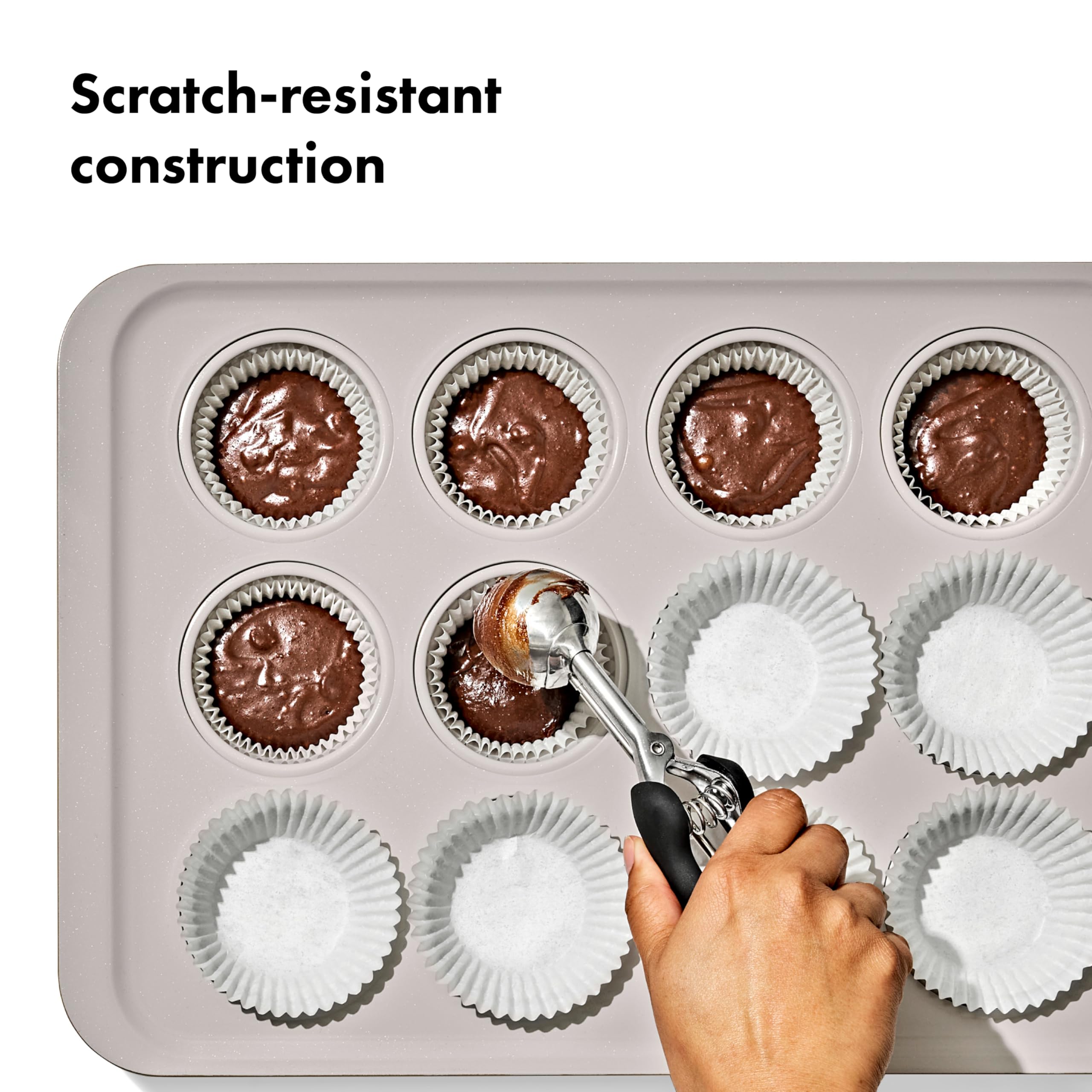 OXO Good Grips muffin pan in use with baked cupcakes demonstrating even browning benefit