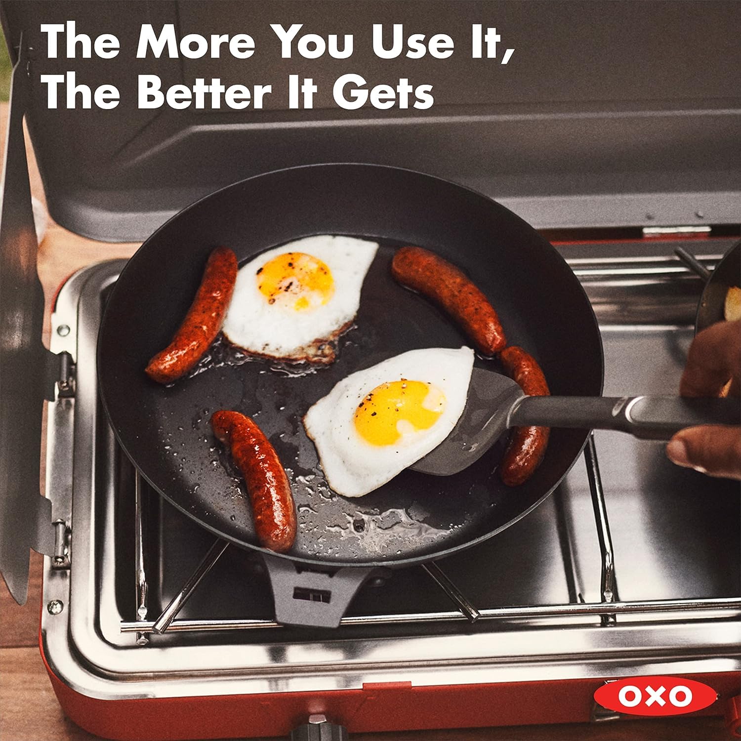 OXO skillet on an outdoor grill demonstrating portability and high-heat performance