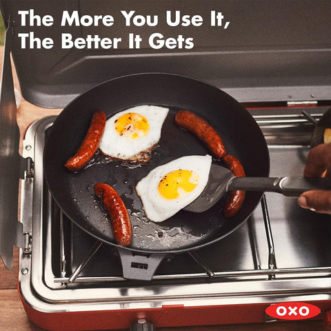 OXO skillet on an outdoor grill demonstrating portability and high-heat performance