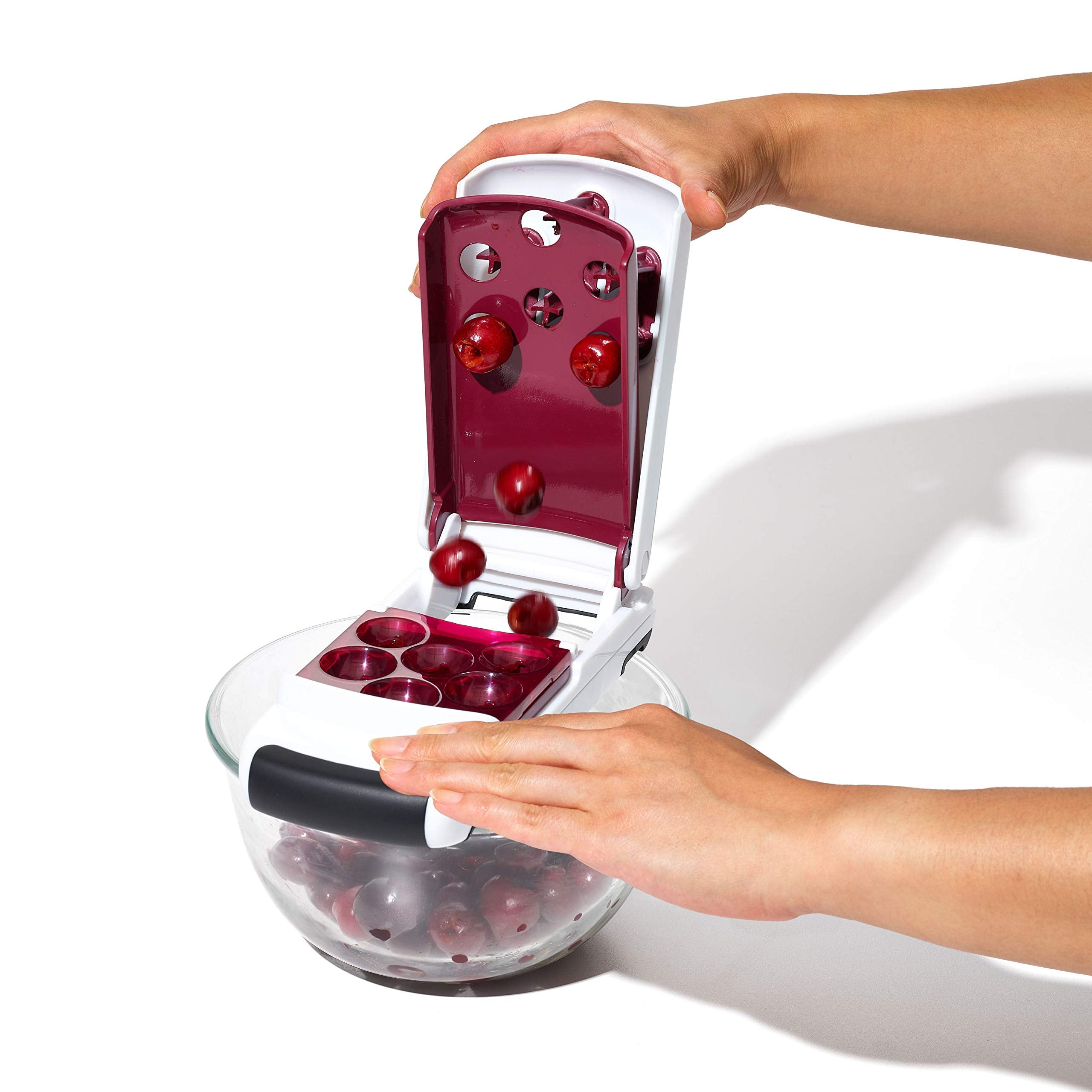 OXO bowl filled with pitted cherries ready for baking or serving