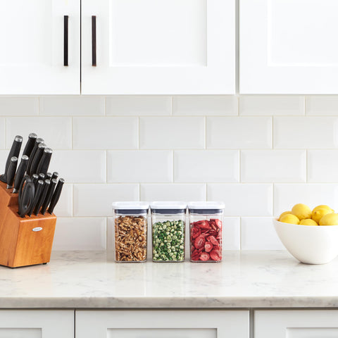 OXO containers arranged on pantry shelf showing organized storage