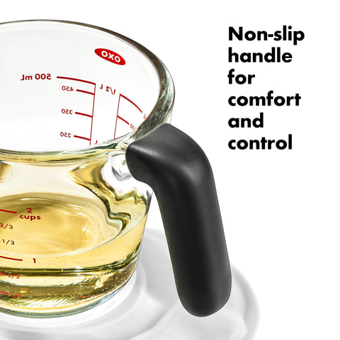 OXO pouring from cup showing dripless spout for neater transfers and precise pouring