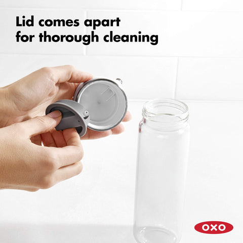 OXO dispenser tipped further for a steady pour adding oil to a hot pan