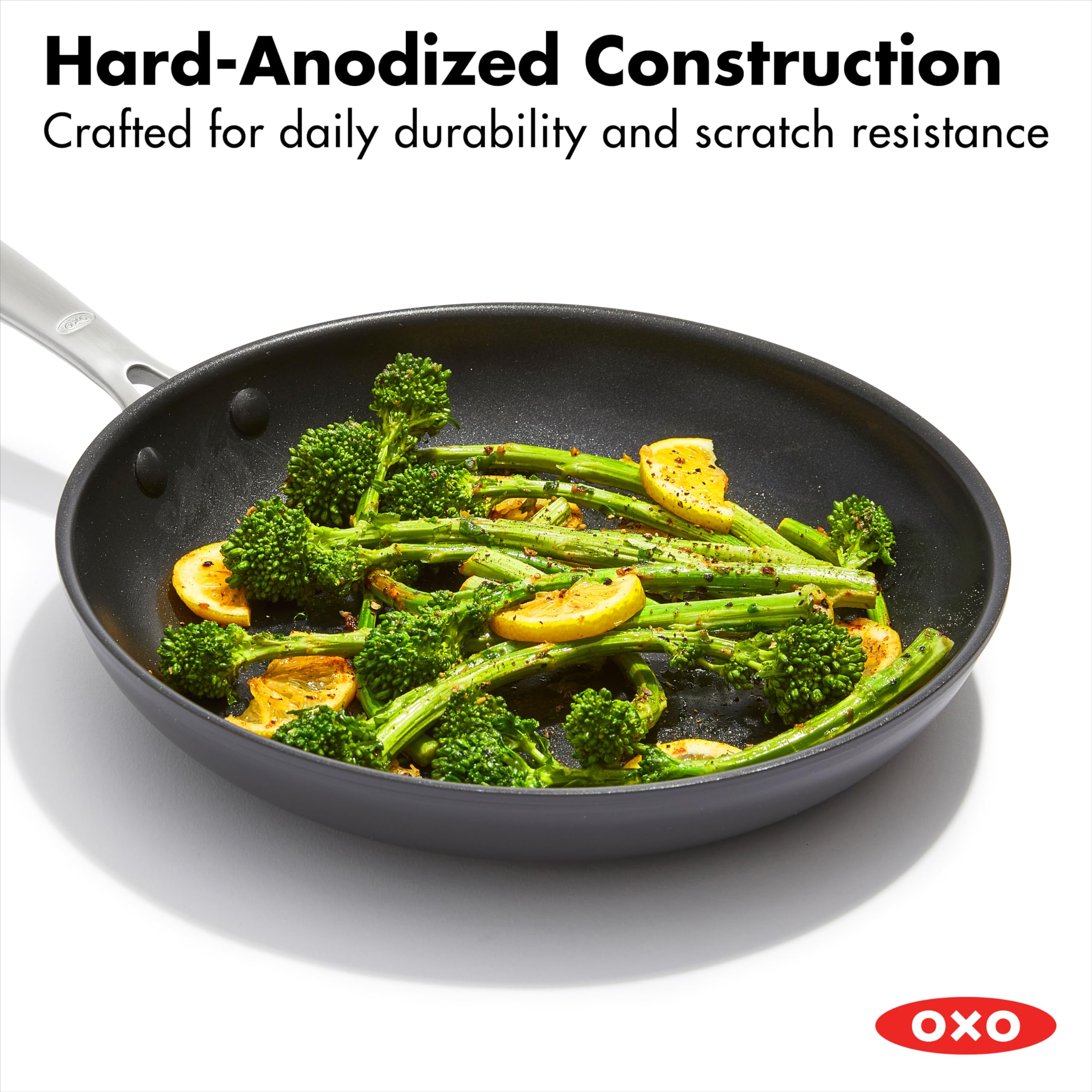 OXO pans on stove with food cooking, demonstrating even heat and performance