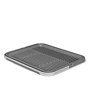 OXO rack beside cutting board showing scale and small-footprint benefit