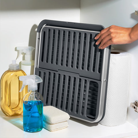OXO size comparison with hands illustrating lightweight portability