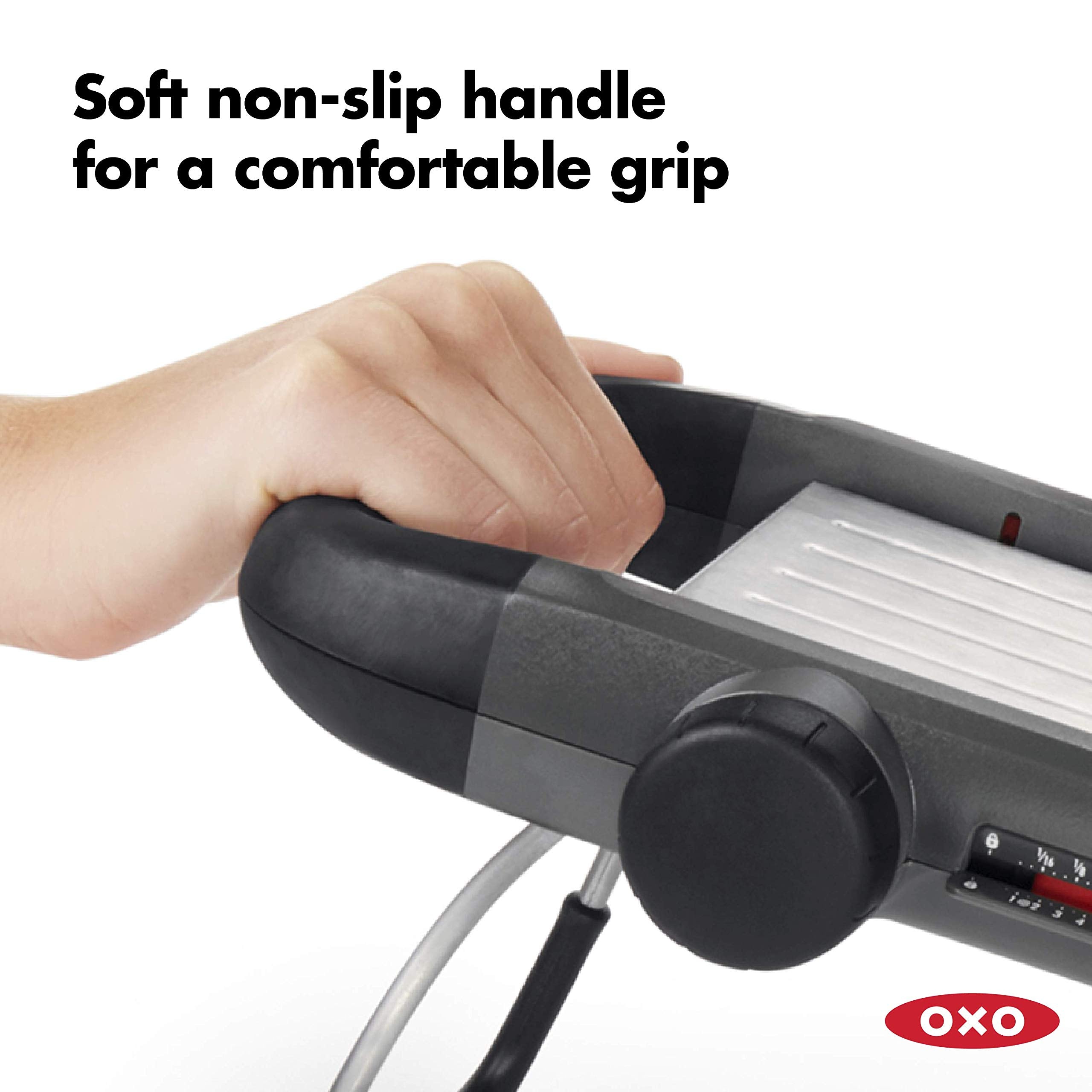 OXO spring-loaded food holder stored under mandoline for safe storage