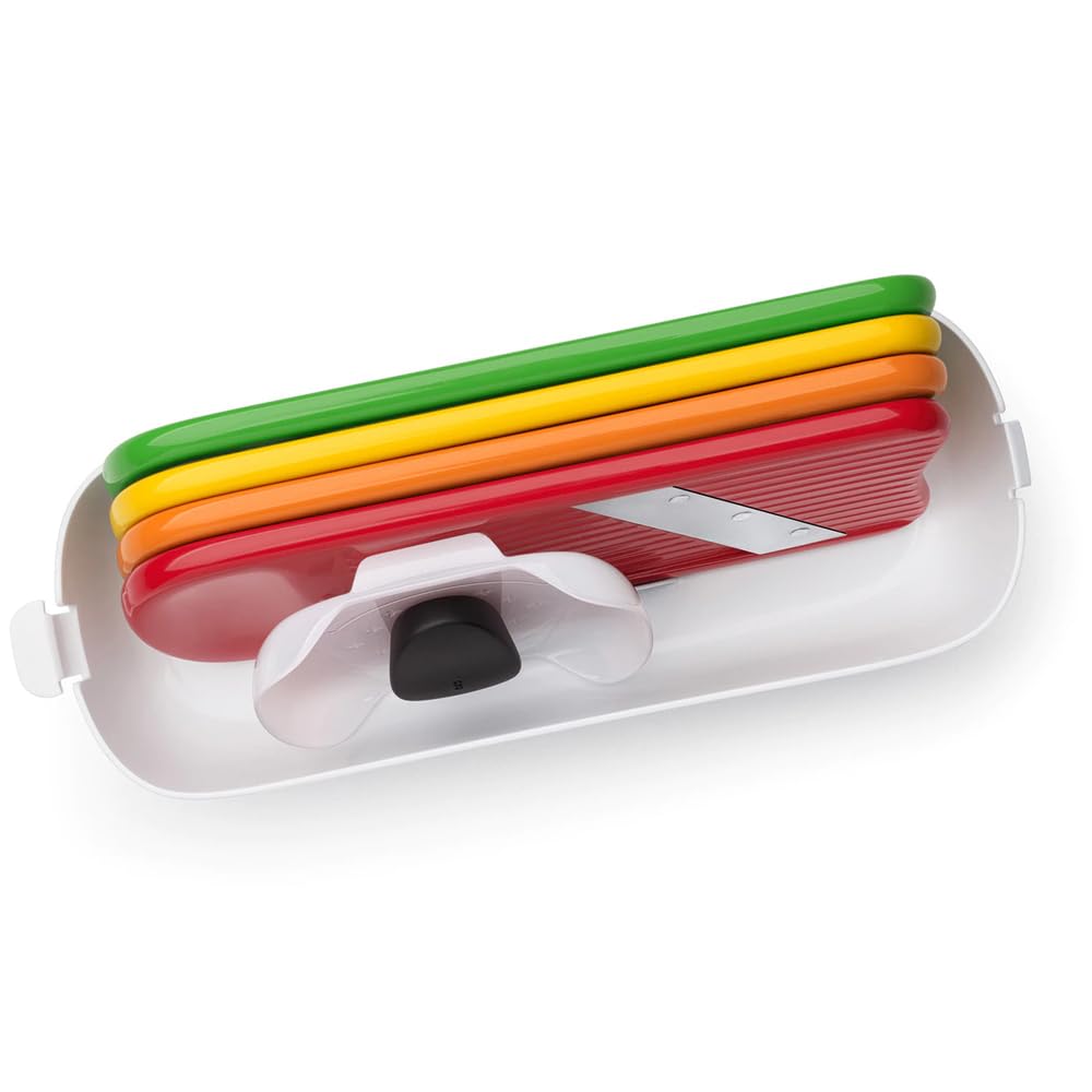 OXO slicer producing uniform zucchini slices for consistent cooking