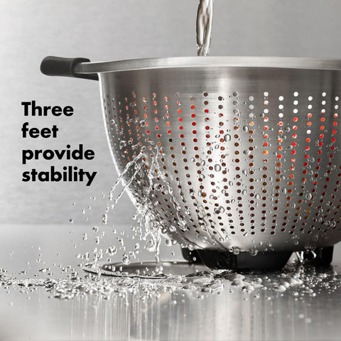 OXO Good Grips strainer draining pasta into pot showing secure control while pouring benefit