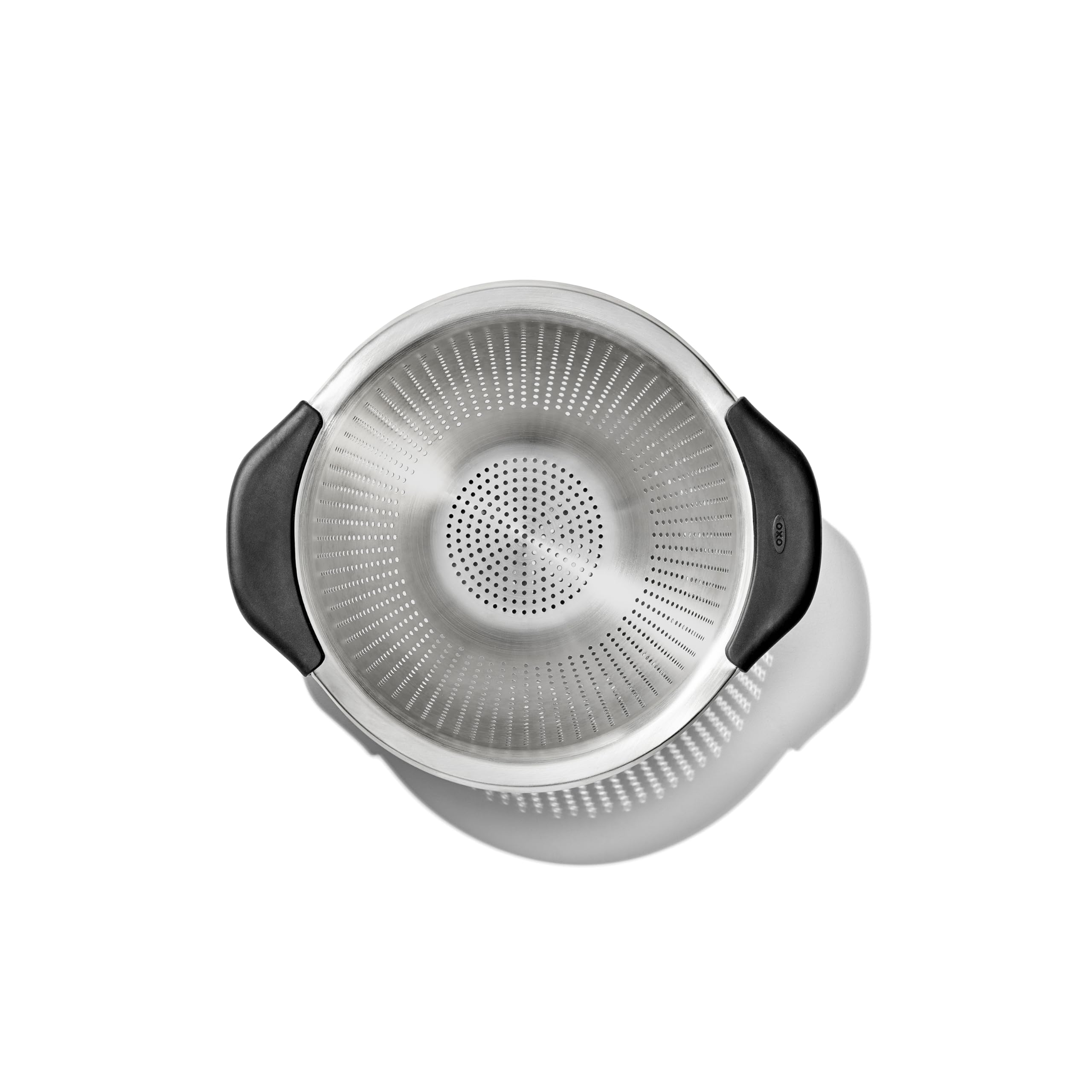 OXO Good Grips perforation pattern close-up showing fast drainage and even straining benefit